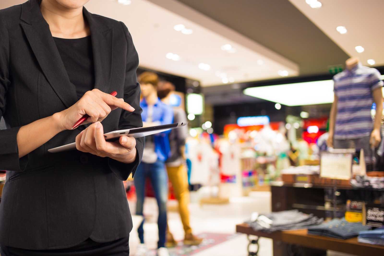 Businesswoman using digital tablet in the shopping mall.